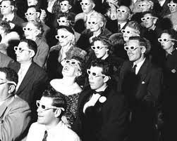 theater audience wearing 3D glasses